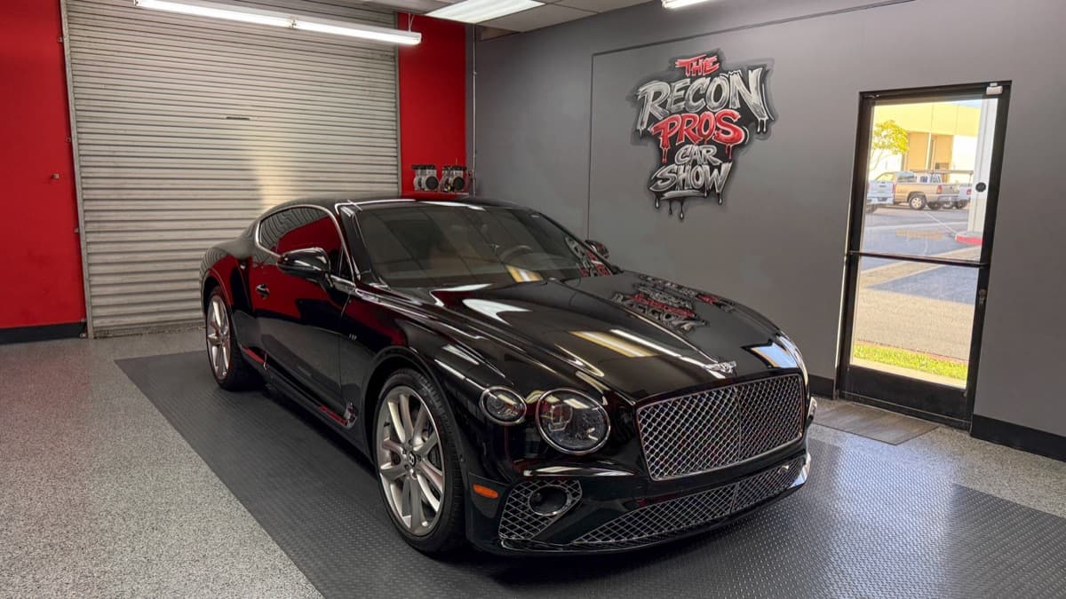 Black Bentley Continental GT after paint correction inside The Recon Pros studio in Huntington Beach